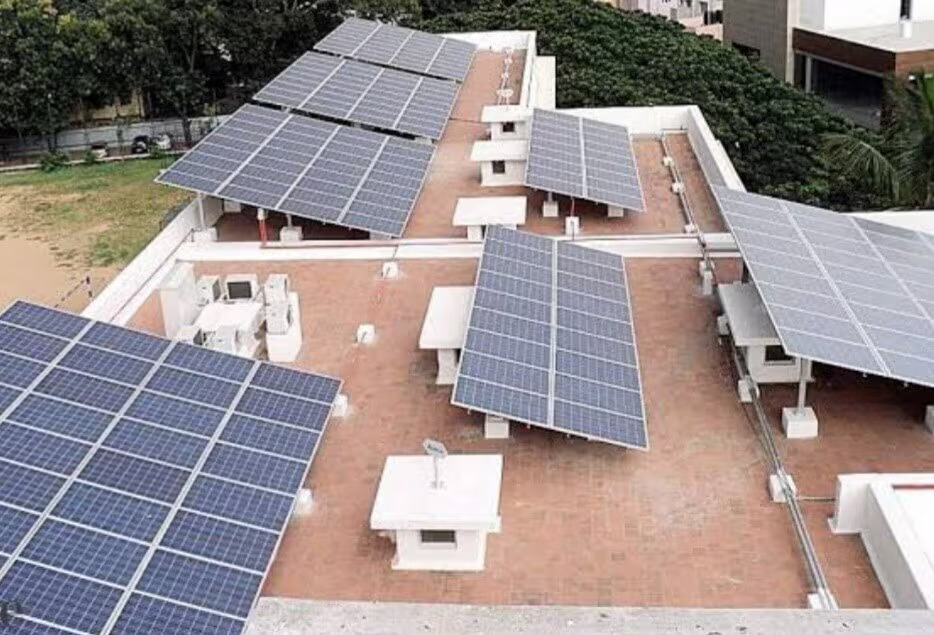 Solar panels on top of residential building in Banswara, Rajasthan, illustrating the adoption of solar energy technology.